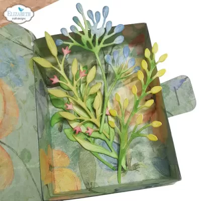 Elementos decorativos em papel de plantas coloridas numa caixa floral