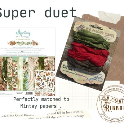 Papéis decorativos florais e de madeira e fitas de tecido verde, vermelha e castanha embaladas