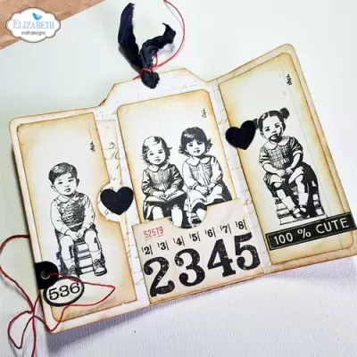 Etiquetas vintage com desenhos de crianças sentadas, números e texto '100% CUTE' decoradas com corações e fio vermelho.