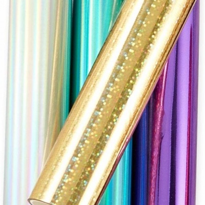 Quatro rolos de papel autocolante brilhante em várias cores