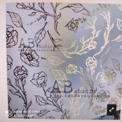 Papel com padrão floral preto e dourado em fundo claro, com texto 'AB studio Super AGN Barania'