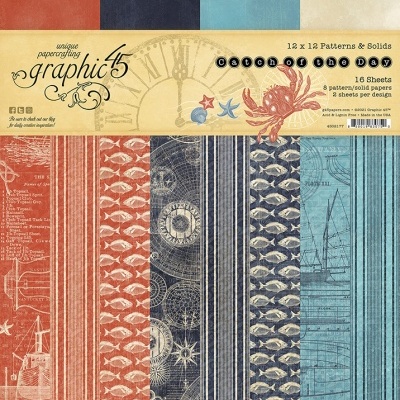 Pacote de papéis para scrapbooking Graphic 45 com padrões náuticos e cores azul, vermelho e bege.