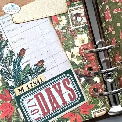 Agenda decorada com padrão floral e etiquetas com texto