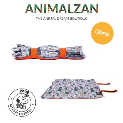 Produto têxtil dobrado com padrão de banda desenhada e acabamento laranja