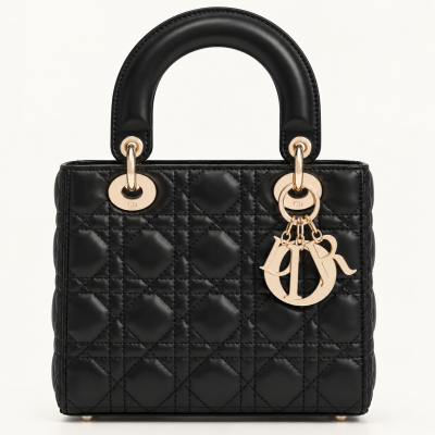 Black quilted leather handbag with gold letter charms and padded handles