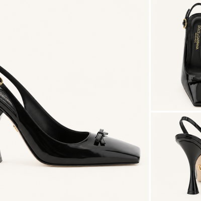 Black patent leather high-heeled slingback shoe with bow and gold DG logo on sole