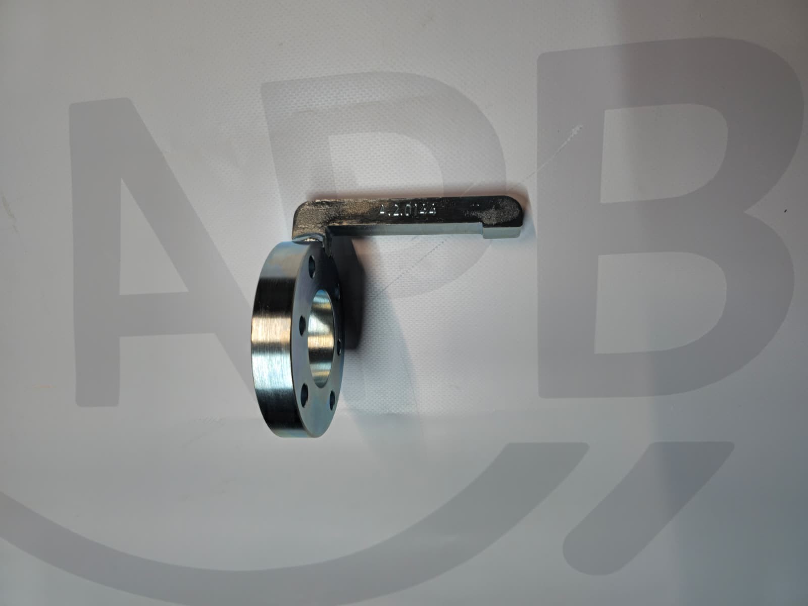 Metal mechanical part with circular flange and arm marked 42.0145 on white background
