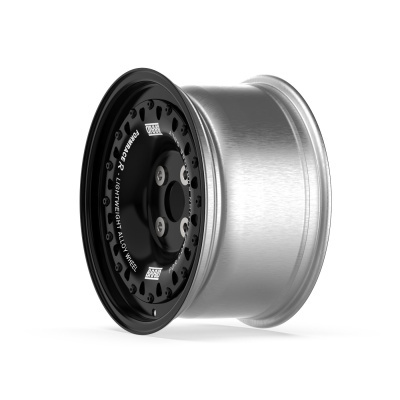 Metallic alloy wheel rim with black center and white text on a white background