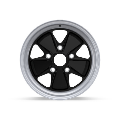 Black and silver metal car wheel rim with five triangular cutouts