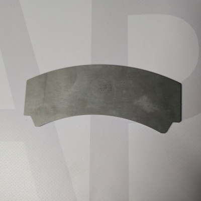 Curved metallic plate with APB logo on white background