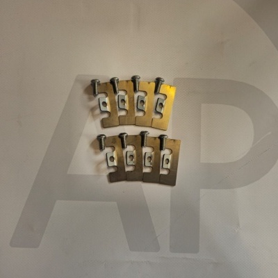 Eight small metallic bracket plates with screws on a white surface.