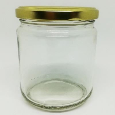 Frasco de vidro transparente com tampa dourada