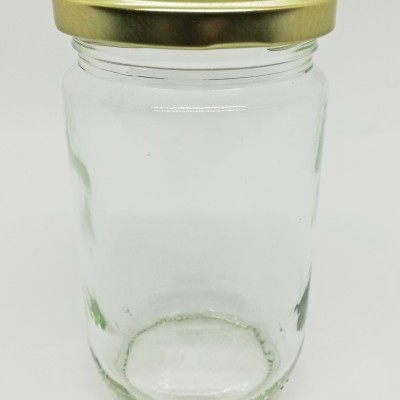 frasco de vidro com tampa dourada