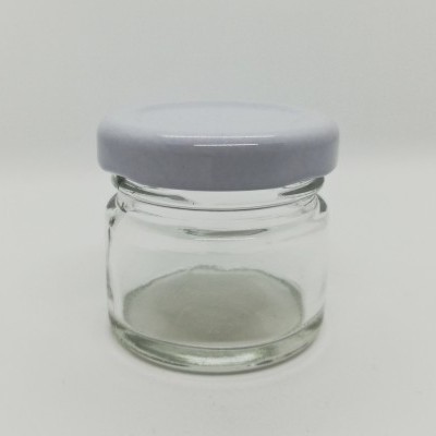 Frasco pequeno de vidro transparente com tampa cinza