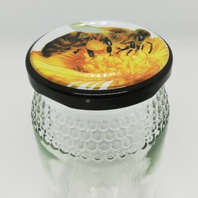 Frasco de vidro com tampa decorada com abelhas e flor amarela