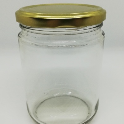 Frasco de vidro transparente com tampa dourada