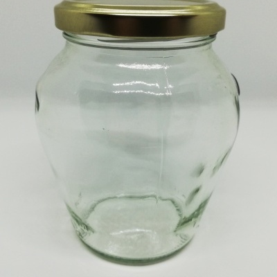 Frasco de vidro transparente com tampa dourada