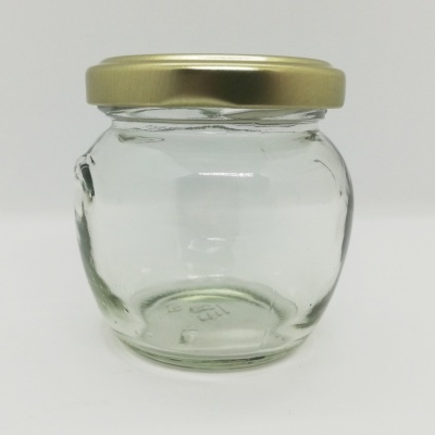 Frasco de vidro transparente com tampa dourada