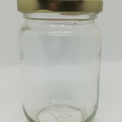 Frasco de vidro com tampa metálica dourada