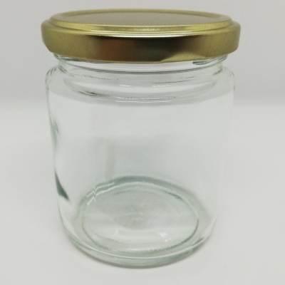 Frasco de vidro transparente com tampa dourada