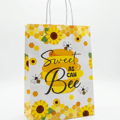 Saco de papel decorado com girassóis e abelhas, com texto Sweet AS CAN Bee