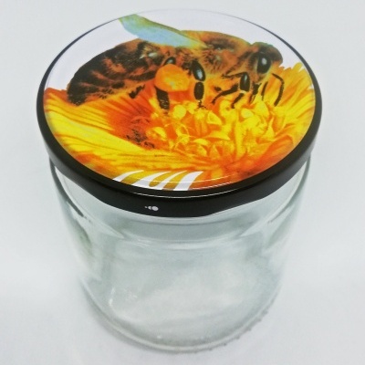 Frasco de vidro com tampa decorada com abelhas e flor amarela