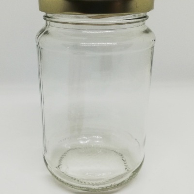 Frasco de vidro transparente com tampa dourada