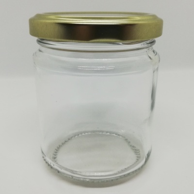 Frasco de vidro transparente com tampa dourada