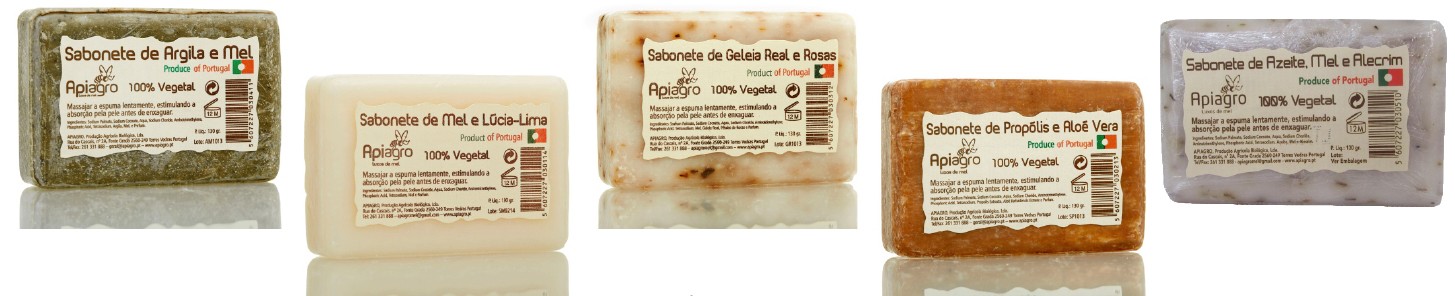 Cinco sabonetes coloridos com etiquetas detalhadas da marca Apiagro