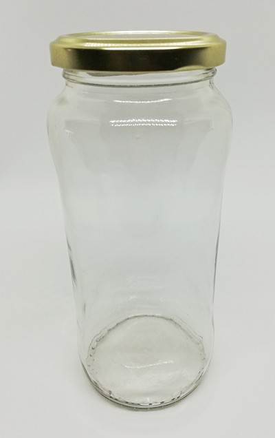 Frasco de vidro vazio com tampa dourada sobre fundo branco