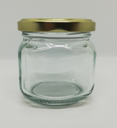 Frasco de vidro com tampa dourada