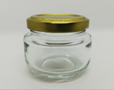 Frasco pequeno de vidro transparente com tampa metálica dourada