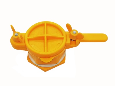 Dispositivo amarelo de plástico com alavanca e parafusos