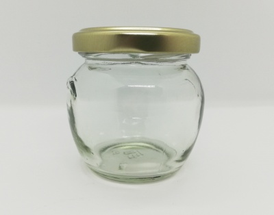 Frasco de vidro transparente com tampa dourada