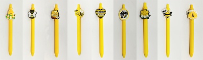 Conjunto de esferográficas amarelas decoradas com temas de abelhas e mel