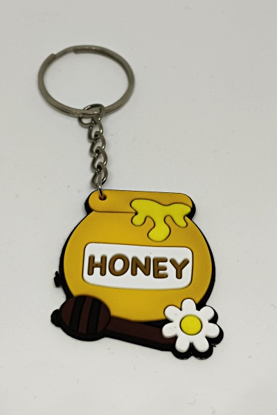 Porta-chaves emborrachado em forma de pote de mel com colher e flor.