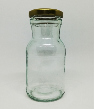 Frasco de vidro transparente com tampa metálica dourada