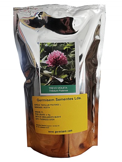 Embalagem metálica prateada com etiqueta amarela e foto de flor violeta