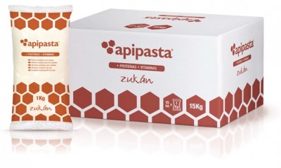 Embalagem e caixa branca do produto apipasta com padrão hexagonal castanho