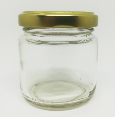 Frasco de vidro transparente com tampa dourada