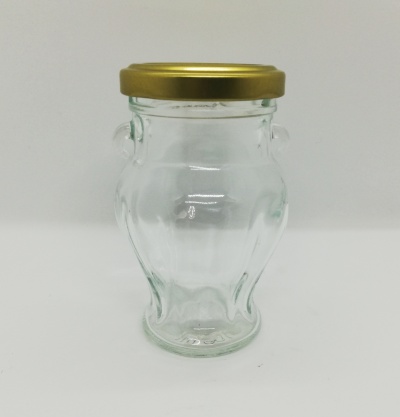 Frasco de vidro transparente com tampa dourada