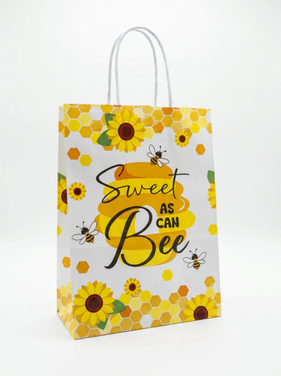 Saco de papel decorado com girassóis e abelhas, com texto Sweet AS CAN Bee