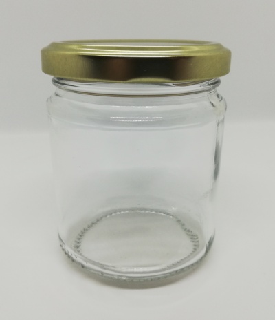 Frasco de vidro transparente com tampa dourada