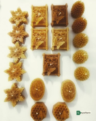 Velas artesanais de cera de abelha em várias formas e texturas naturais.