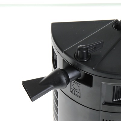 Eletrodoméstico preto cilíndrico com bocal e símbolo de reciclagem