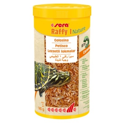 Recipiente amarelo de alimento para tartarugas sera Raffy Nature com texto multilíngue e imagem de tartaruga.