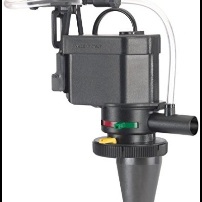 Dispositivo mecânico preto com tubo transparente e partes coloridas