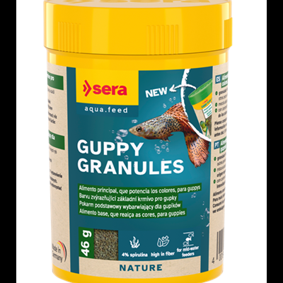 Recipiente amarelo de ração para peixes Guppy Granules com rótulo azul e verde e imagem de guppy
