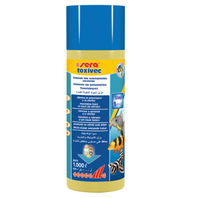 Frasco de produto água para aquários sera toxivec com rótulo azul e imagens de peixes.