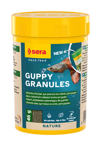 Recipiente amarelo de ração para peixes Guppy Granules com rótulo azul e verde e imagem de guppy